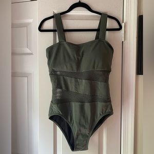 Green one piece with mesh cut outs